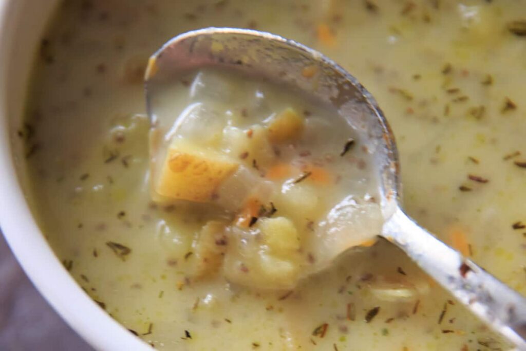 Chunky potato soup with loads of herbs makes for a lovely comforting cold-weather meal in the fall. Make it creamy if you want, Gluten-free with dairy-free option.