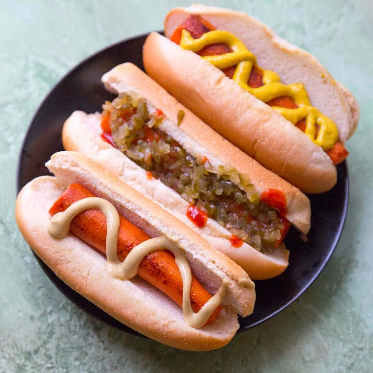 3 vegan carrot not dogs with relish, mustard, ketchup