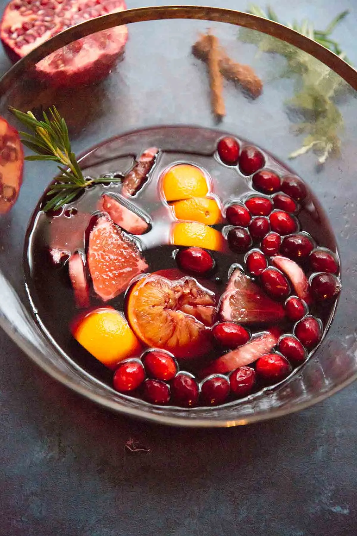 Holiday Sangria  with cranberries and orange and rosemary