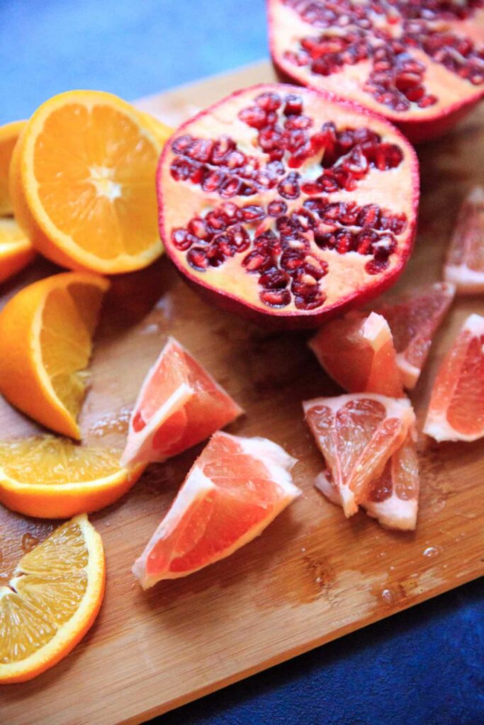 Holiday Sangria - cut up oranges, pomegranate and pomelo pieces