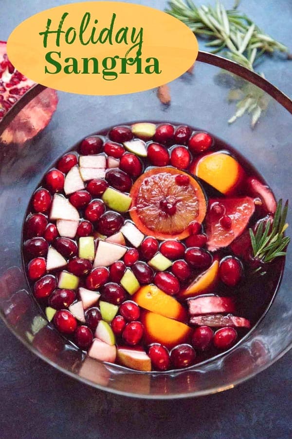 Holiday Sangria - a dry red wine winter sangria that's not too sweet, filled with fruit and is designed to make you feel cozy.