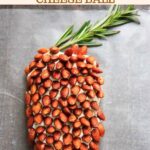 A cheese ball that looks like a pine cone! This appetizer will be a hit at your party. Using rosemary sprigs and cinnamon honey roasted almonds.