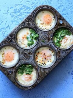 make-ahead egg breakfast cups in a muffin tin - customizing with spinach, cheese and herbs baked