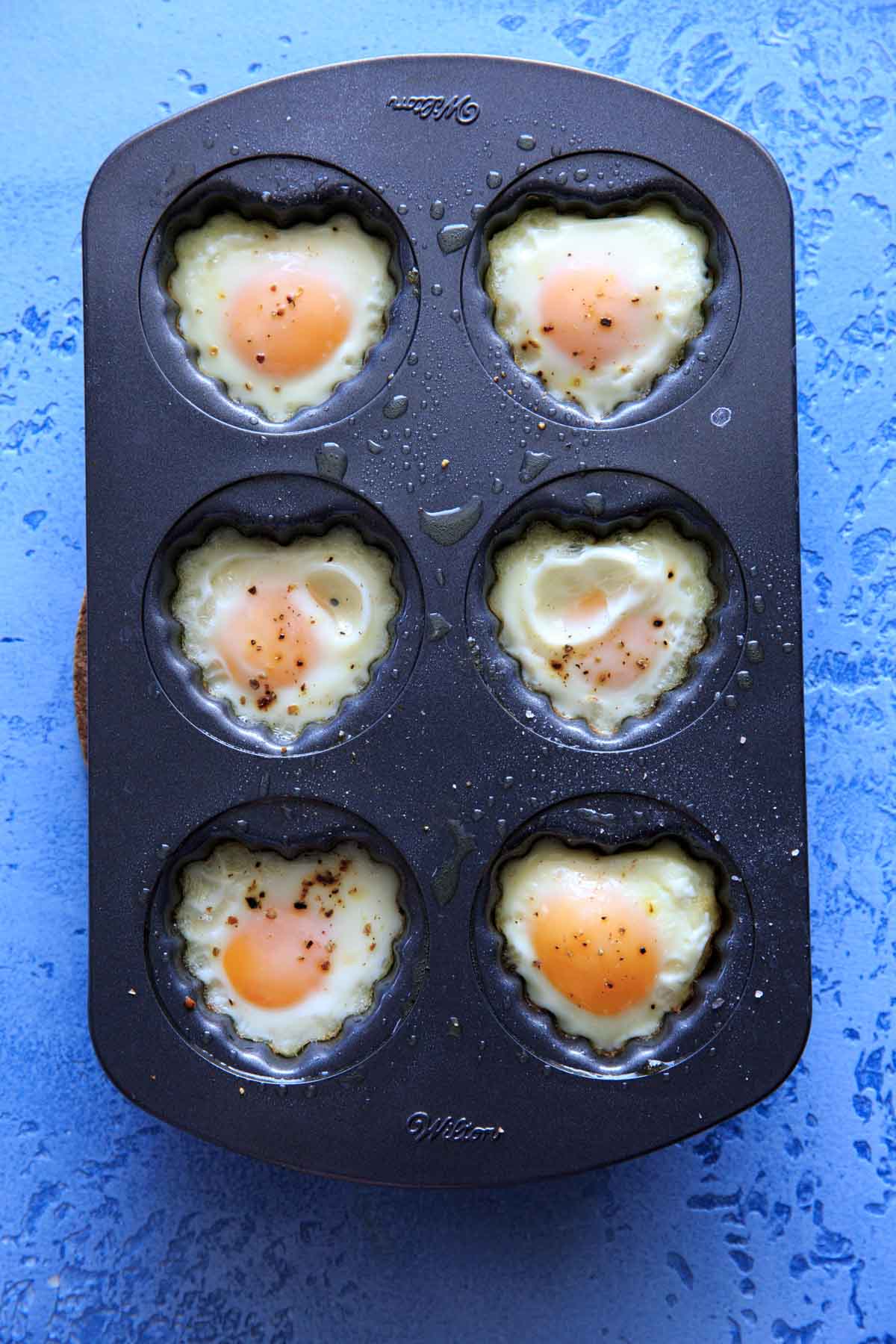 heart shaped egg breakfast cups in a heart muffin pan