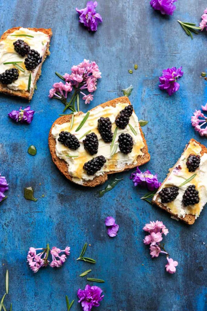 Blackberry Ricotta Toast with honey drizzle. Makes for a great breakfast, midday snack, or even a fruit berry dessert!