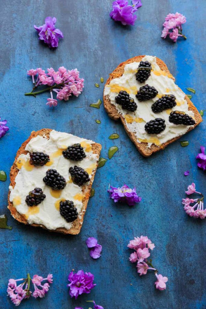 Blackberry Ricotta Toast with honey drizzle. Makes for a great breakfast, midday snack, or even a fruit berry dessert!