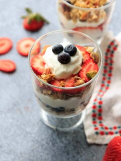 Red, white and blue berry parfait! Layered with yogurt and granola, you'll love this easy recipe for a filling snack or healthy breakfast treat. 