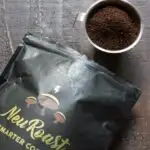 Neuroast coffee ground poured into cup with bag