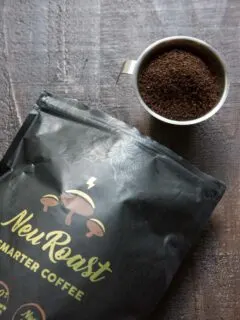 Neuroast coffee ground poured into cup with bag