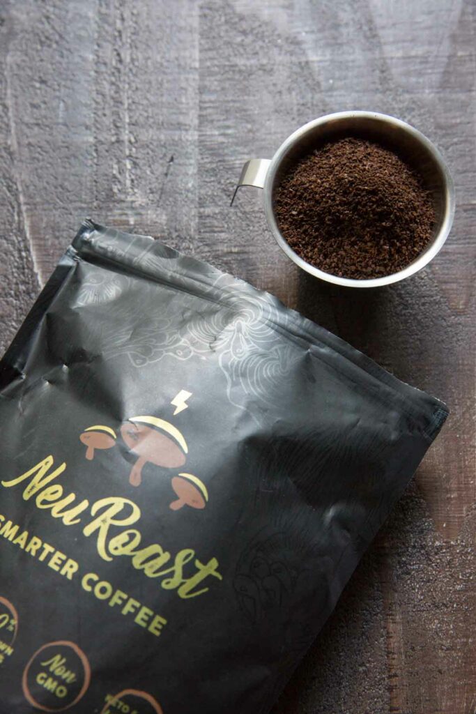 Neuroast coffee ground poured into cup with bag