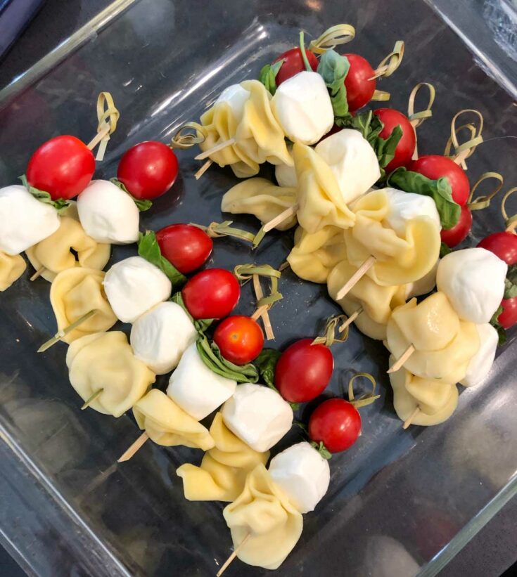 prepping caprese pasta salad skewers