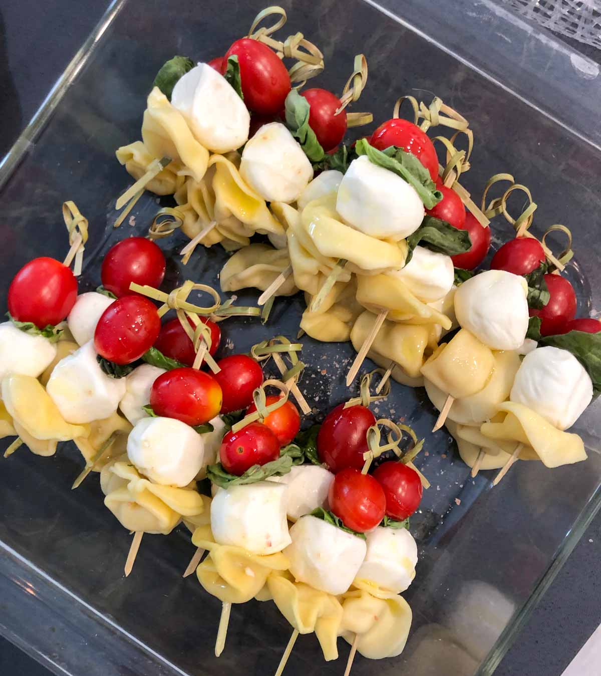 prepping caprese pasta salad skewers