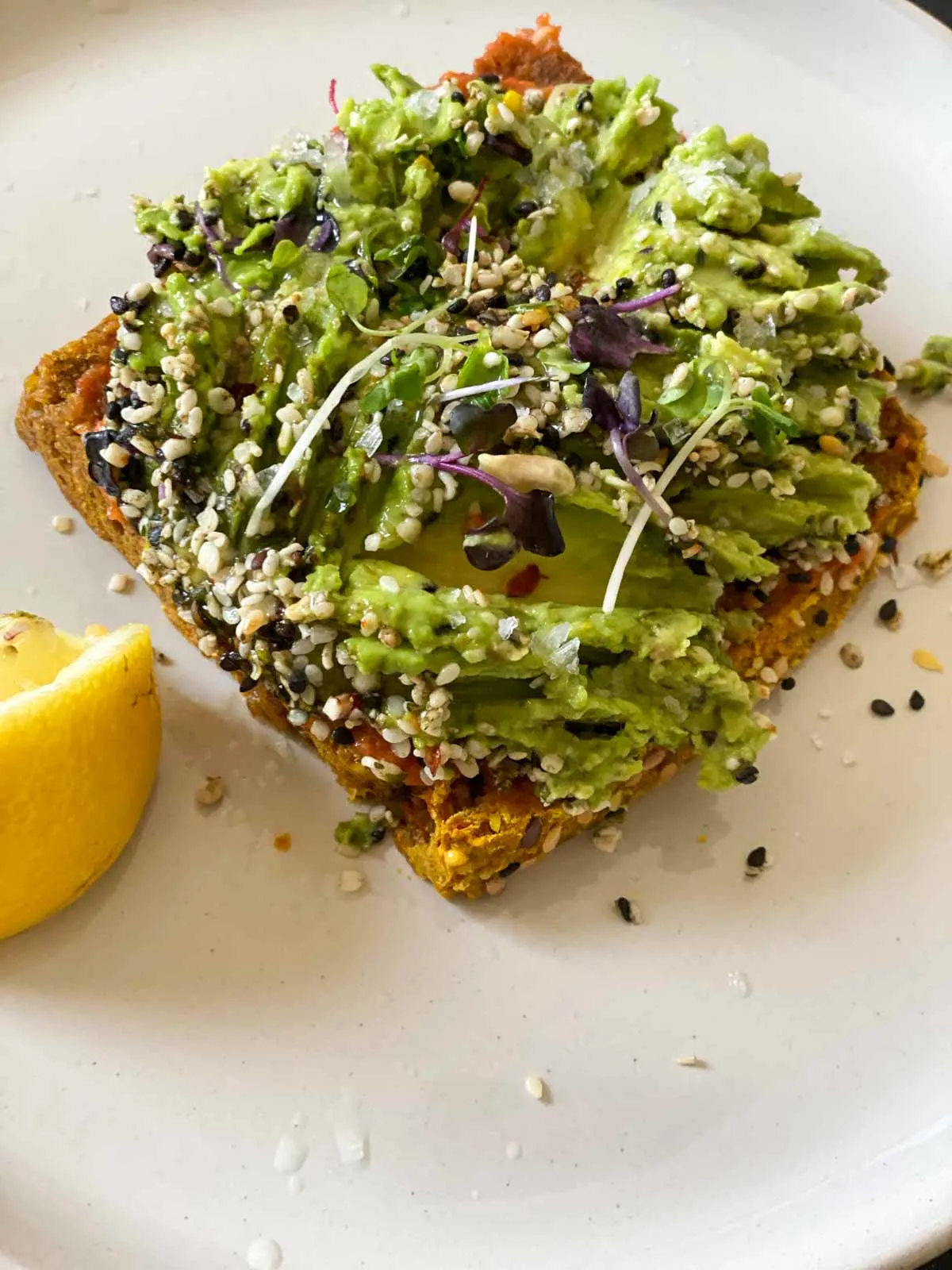 sakara style avocado toast with pasilla chili-tomato butter