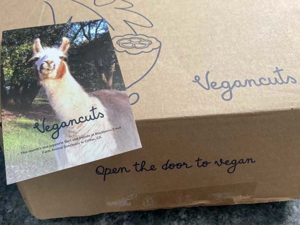 Vegancuts box and animal sanctuary donation postcard