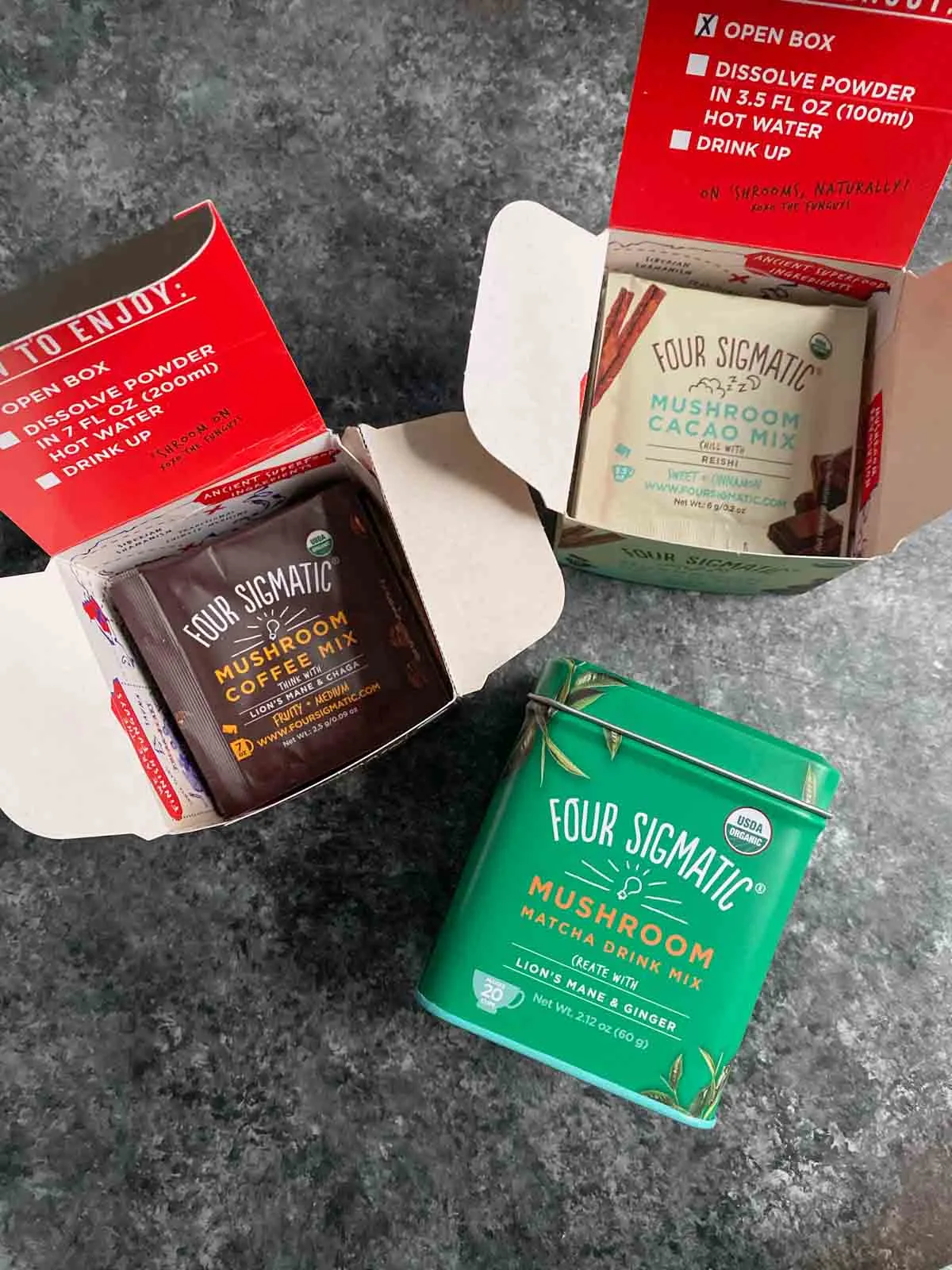 Four Sigmatic coffee and cacao packets with matcha