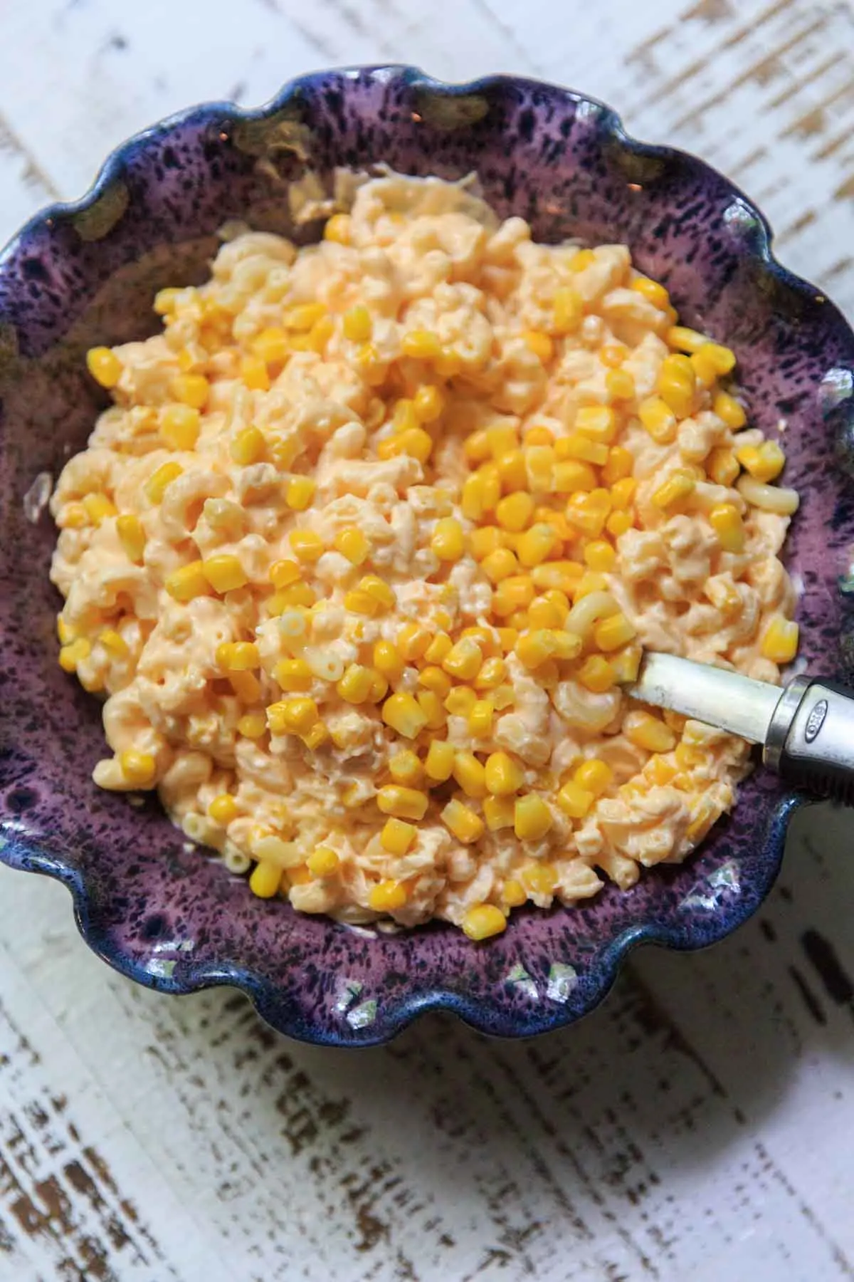 macaroni and cheese with corn in serving bowl