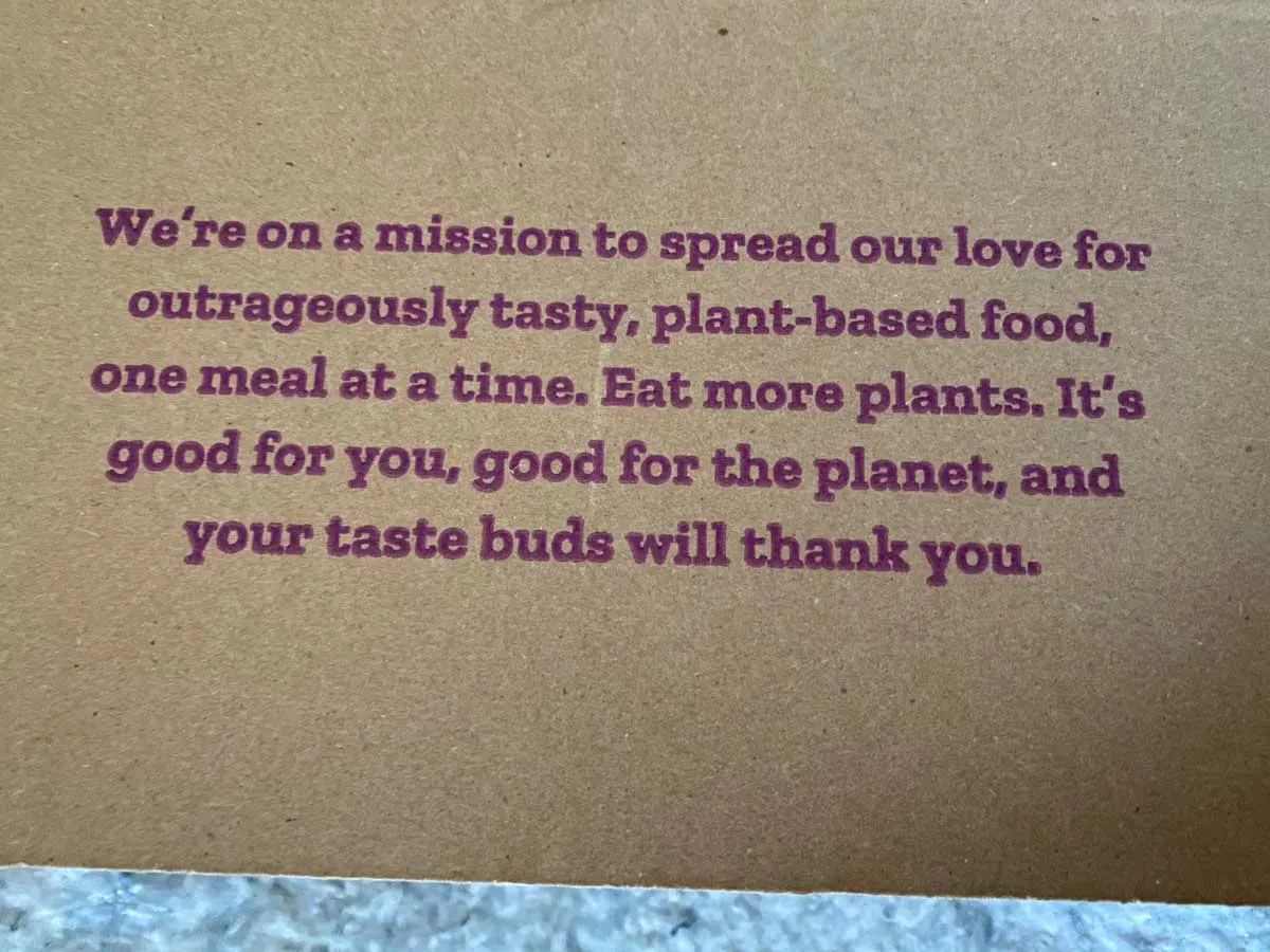 Purple Carrot delivery box mission statement - We're on a mission to spread our love for outrageously tasty, plant-based food, one meal at a time.