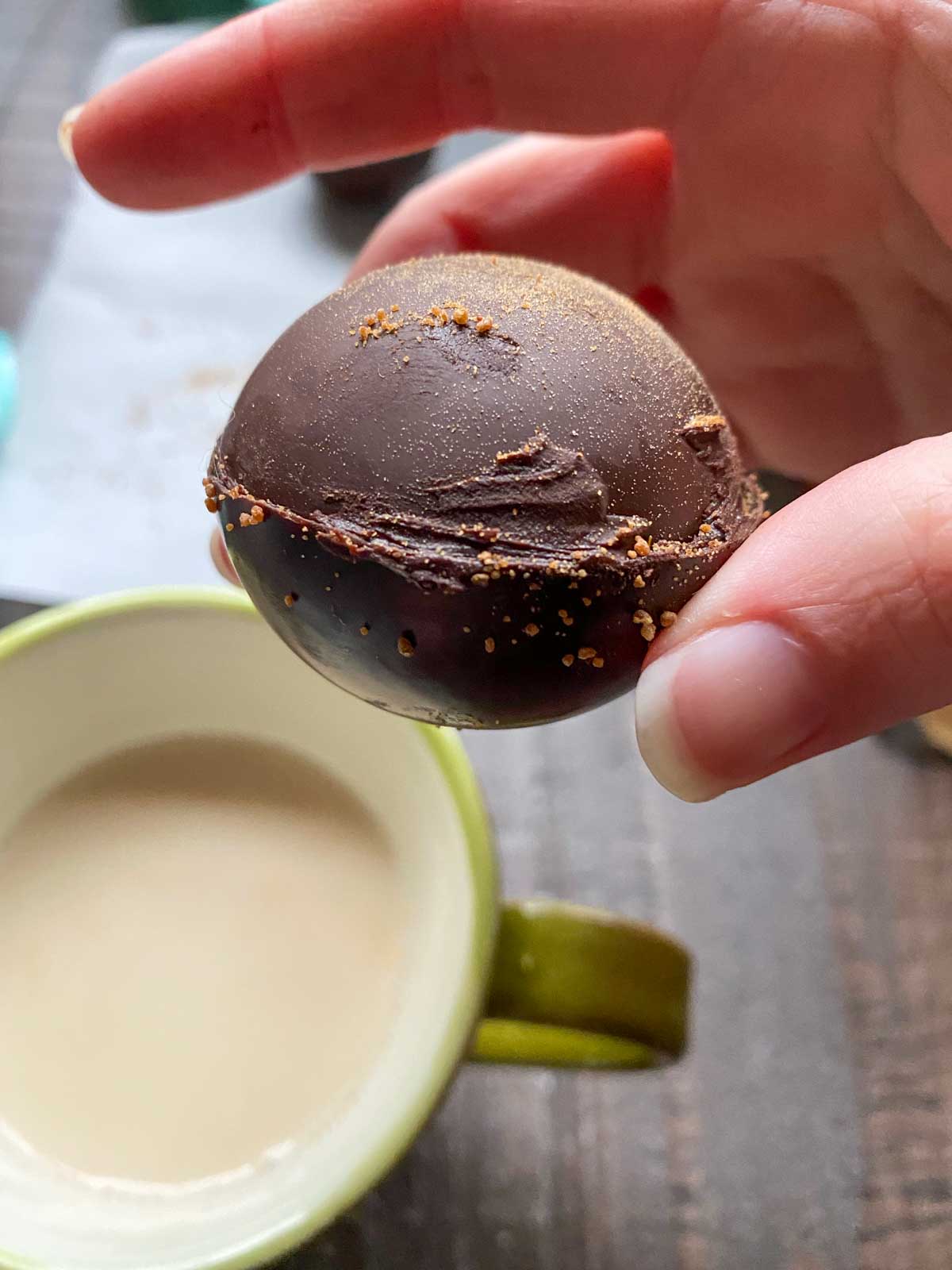 hot cocoa bomb before putting in mug of hot oat milk