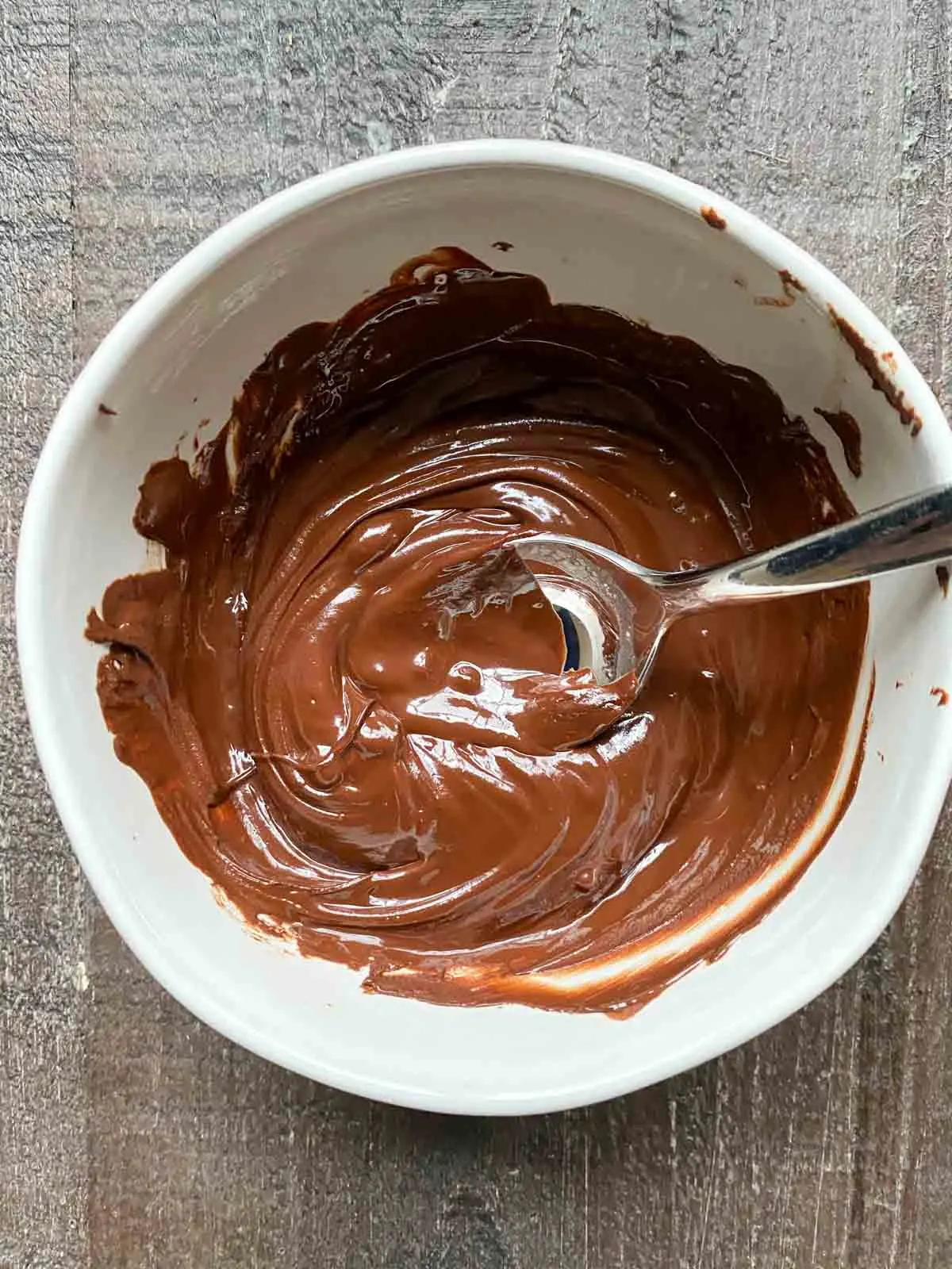 melted enjoy life dark chocolate chips in a bowl