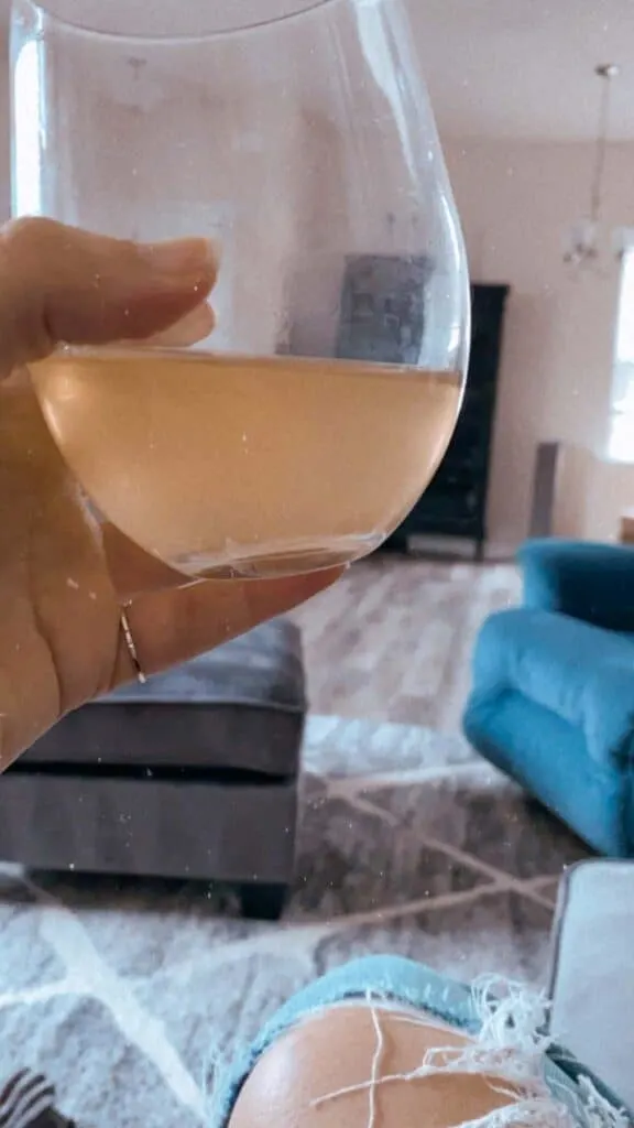 Haus flavor Lemon Lavender + Ginger Beer in a wine glass