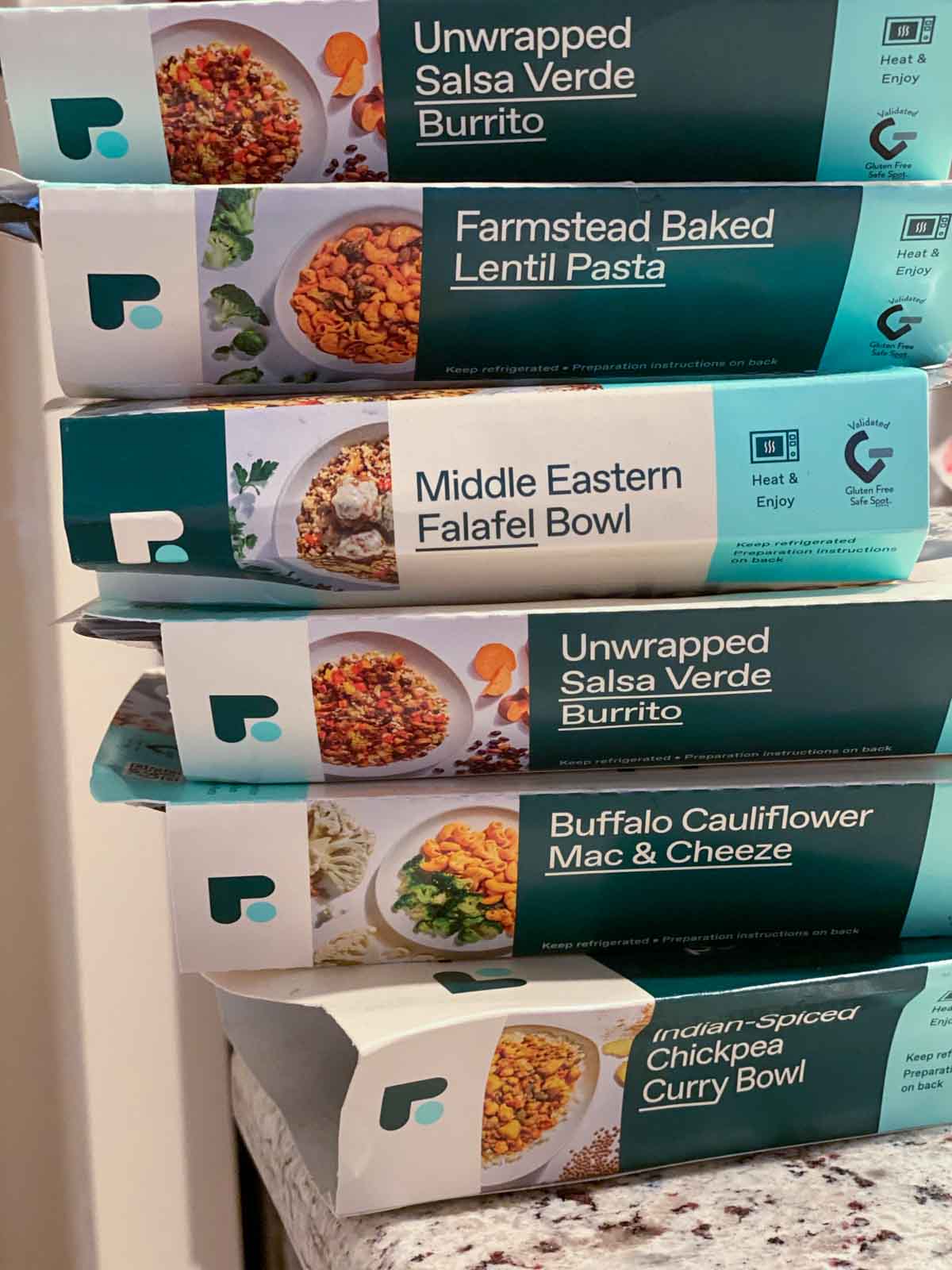 stack of 6 meals from Freshly's purely plant menu