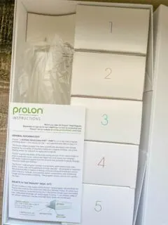 Prolon instructions with 5 small boxes of food, one for each day of the fasting mimicking diet