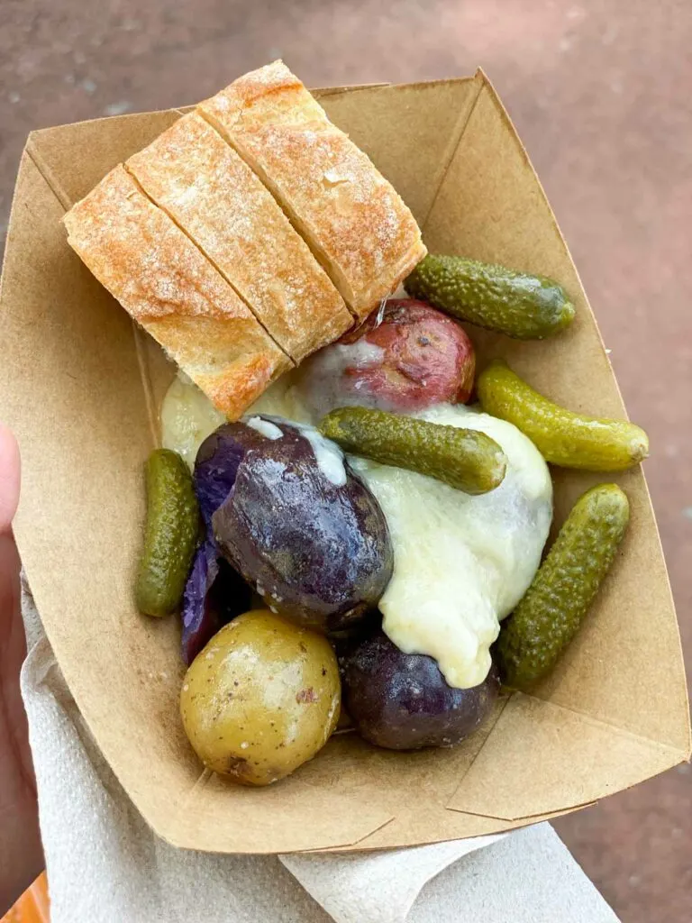 Epcot the Alps Warm Raclette Swiss Cheese with Baby Potatoes, Cornichons (pickles) and Baguette