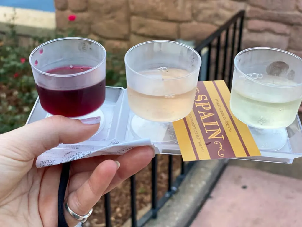 Epcot food and wine festival spain wine flight, one red one rose and one white wine