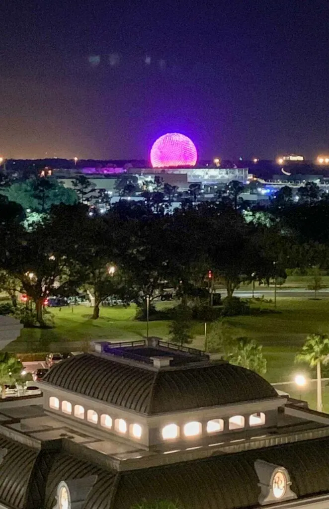 nighttime view of the epcot ball from the skyliner