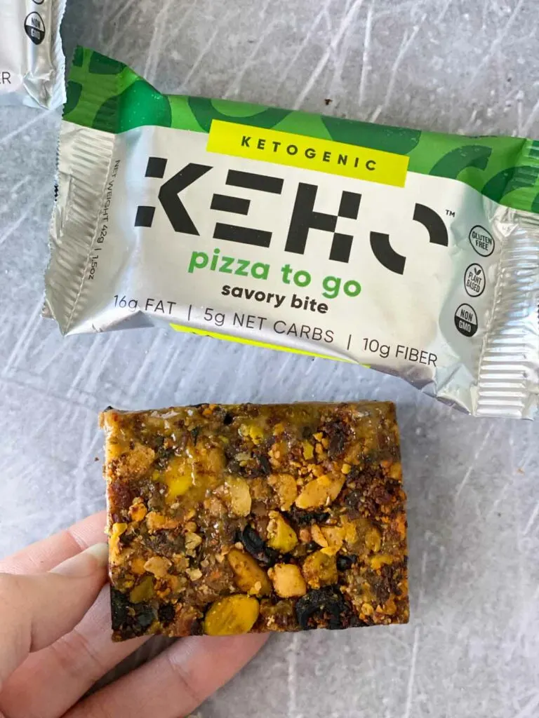 KEHO pizza to go in-hand next to wrapper