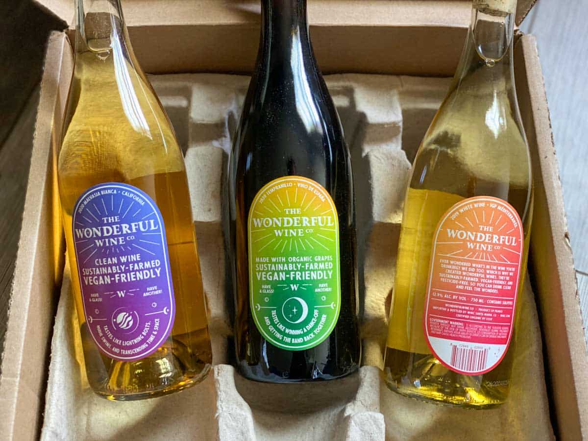 3 bottles of wonderful wine co in packaging - white, red, orange