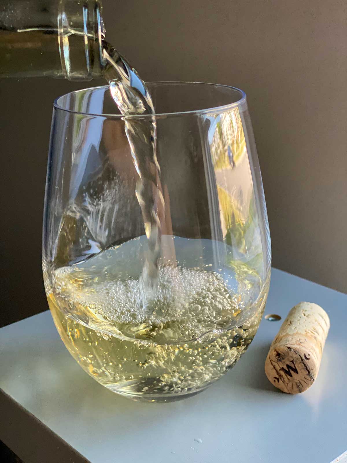 pouring wine wine into wine glass