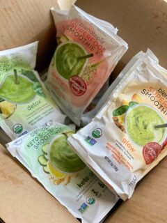 shipment box full of blendtopia smoothie packet flavors