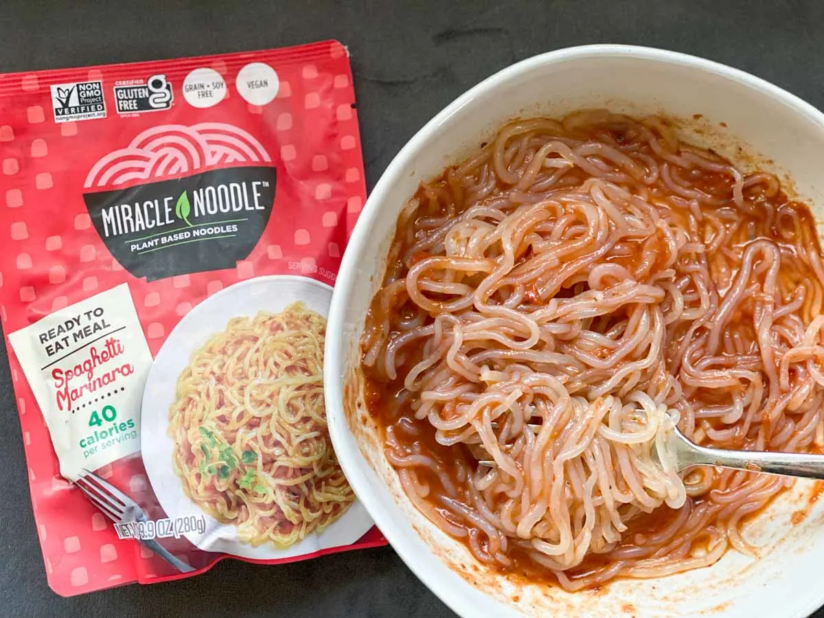 miracle noodle spaghetti marinara in bowl next to package