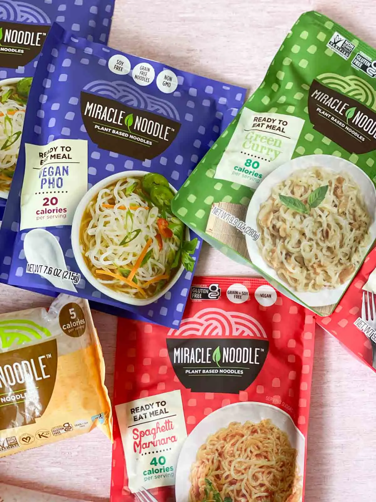 Miracle noodle packages - spaghetti marinara, vegan pho, and green curry