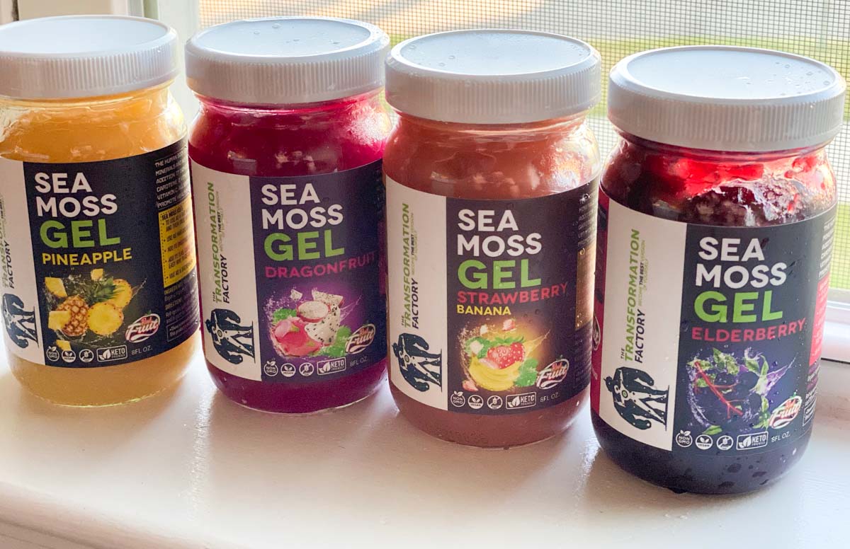 4 jars of seal moss gel sitting side by side - pineapple, dragonfruit, strawberry banana and elderberry