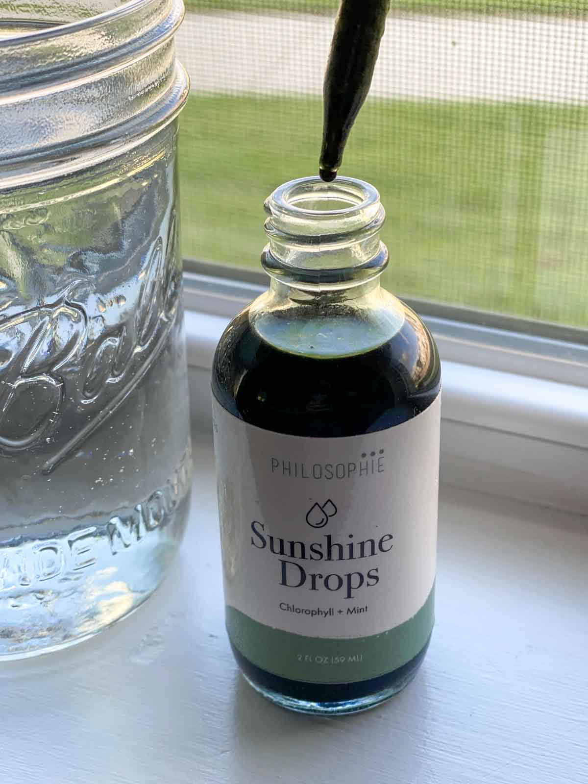 Philosophie's sunshine drops with dropper raised to show color