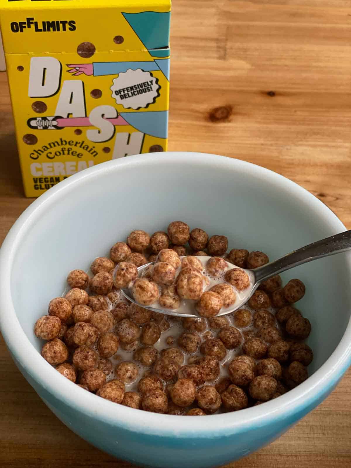 coffee OffLimits cereal in bowl with spoonful of cereal and milk lifted
