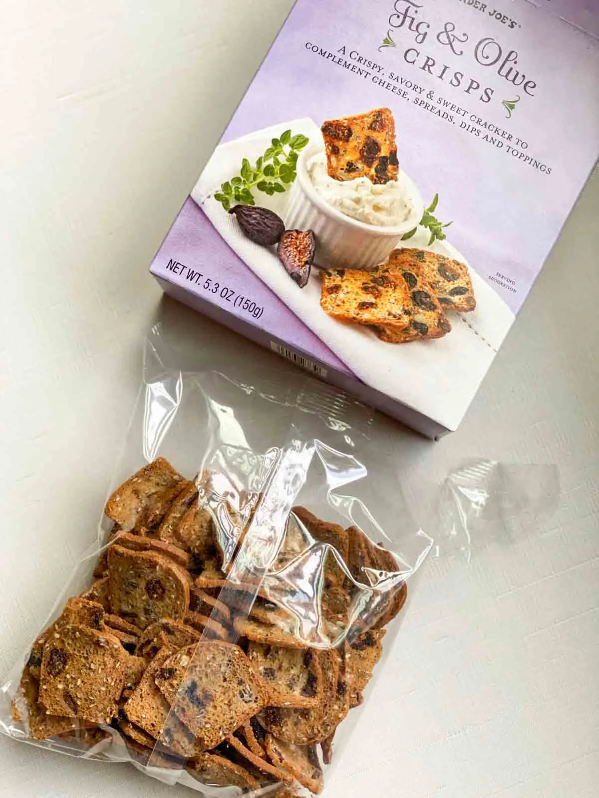 bag of fig and olive crisps next to packaging