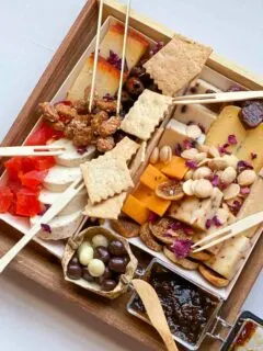 Cicette cheese board from Boarderie, unwrapped and arranged with bamboo cutlery