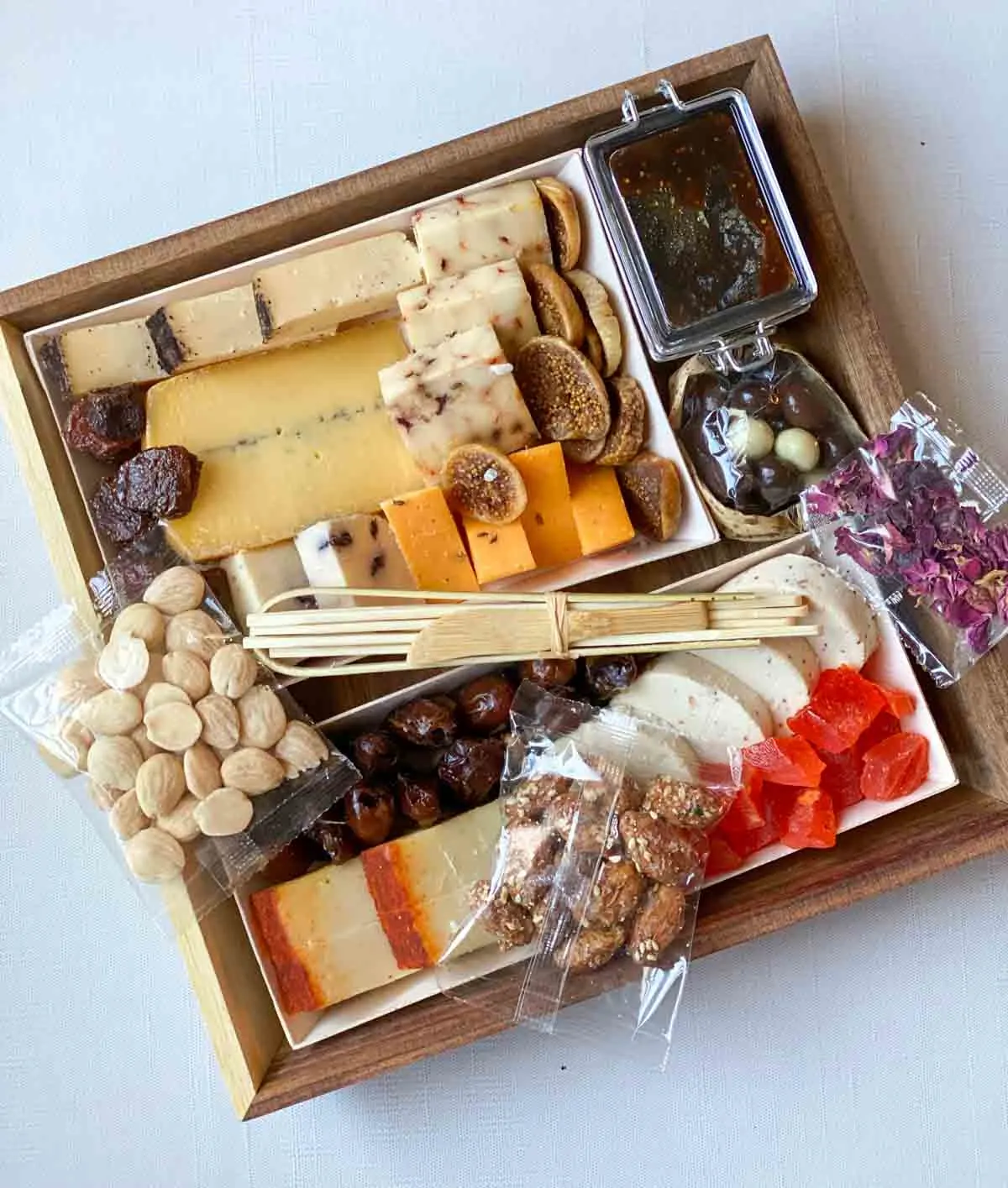 Cicette cheese board with nuts still in packages
