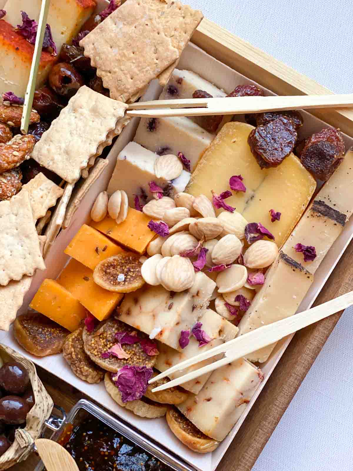 close up of some of the cheese board from Boarderie, arranged with bamboo cutlery