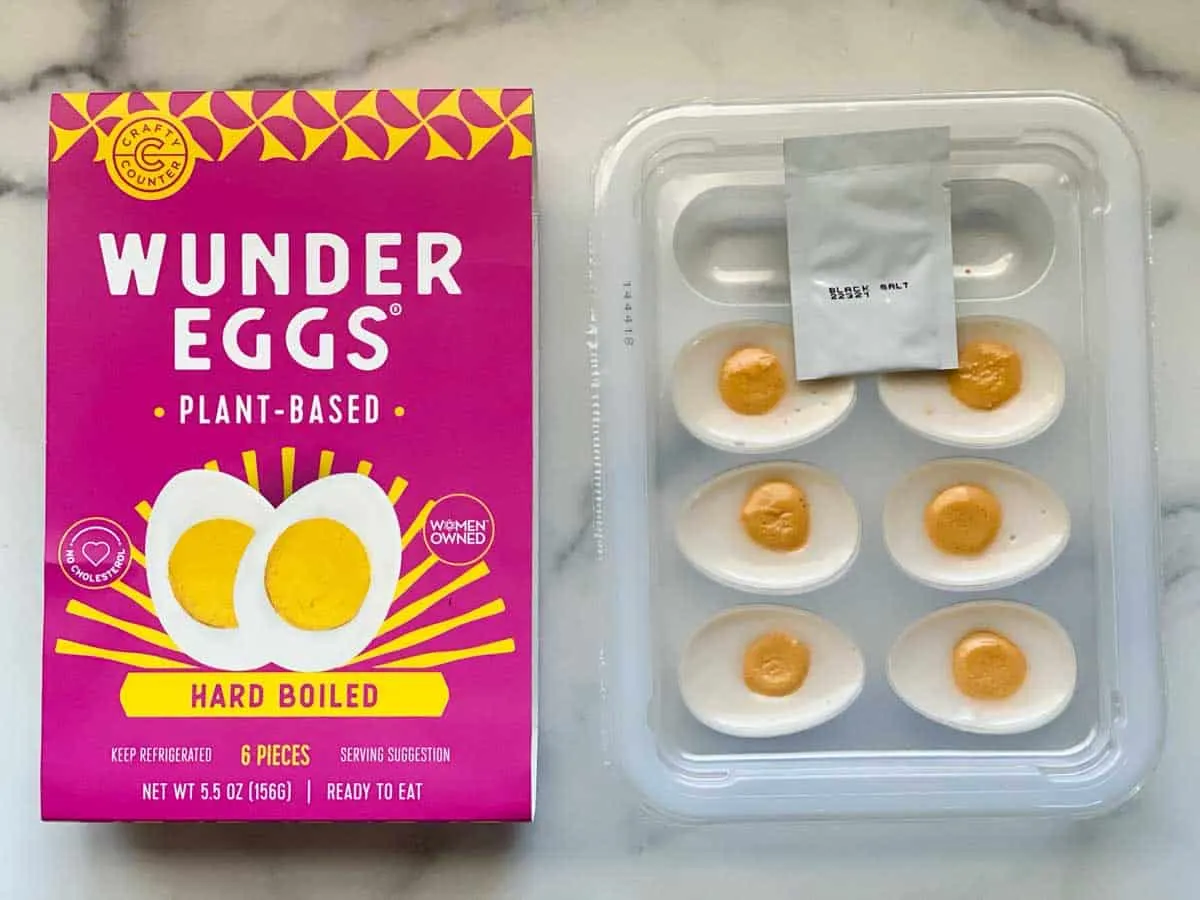 6 halves of Wunder Eggs pulled out of container next to packaging