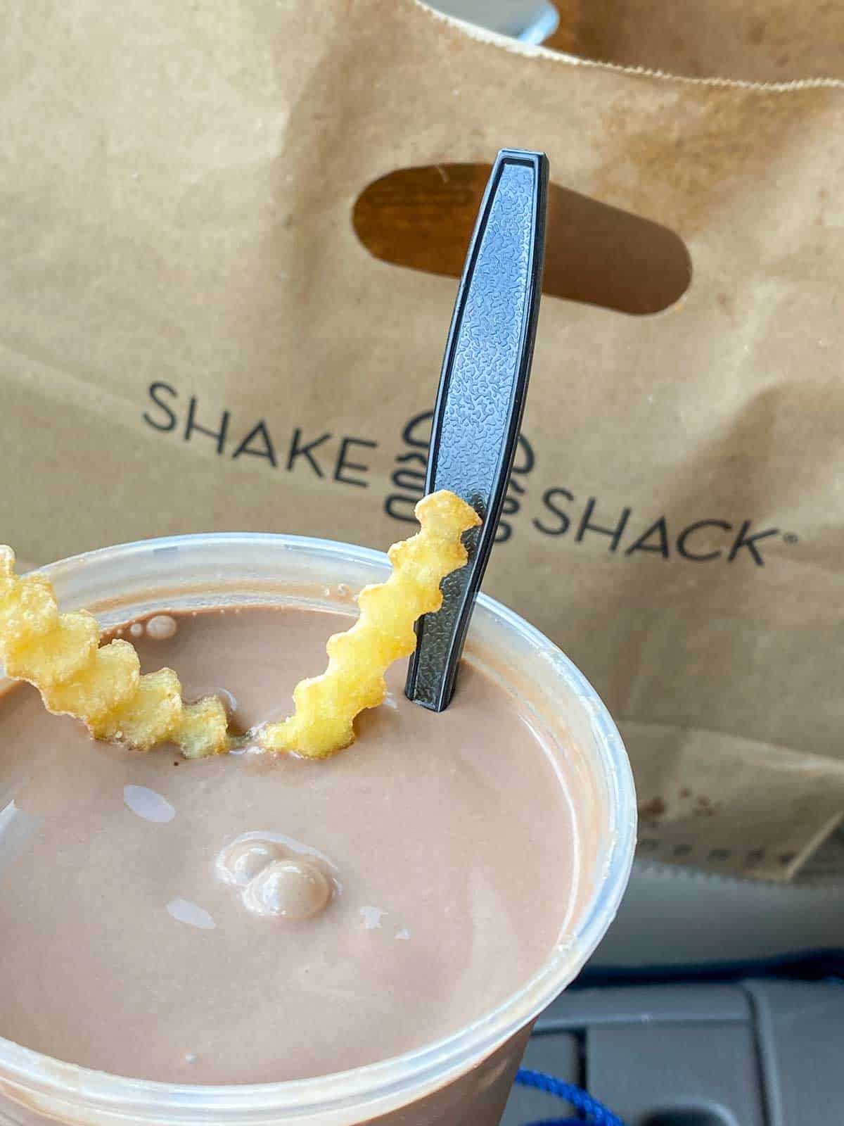Shake shack chocolate milkshake with fries dipped in