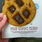 the chocolate chip cookie from nowhere bakery next to packaging