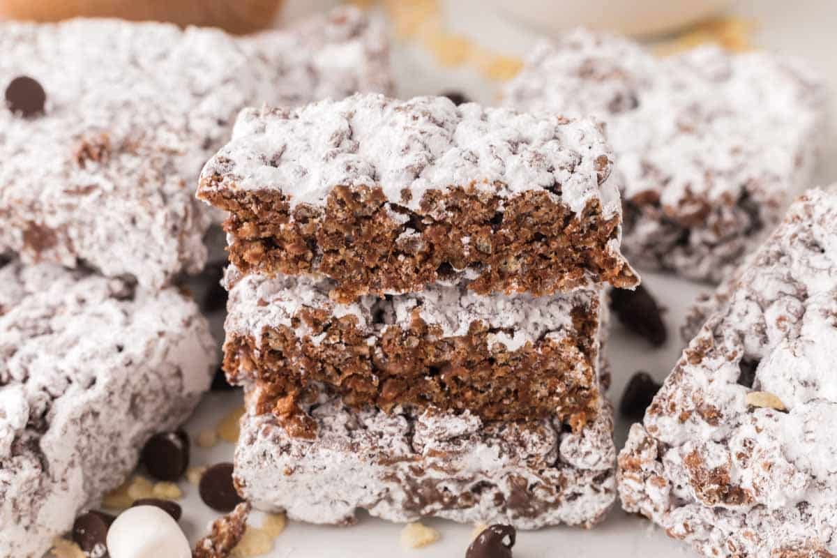 muddy buddy rice crispy treat bars stacked so you can see the middle.