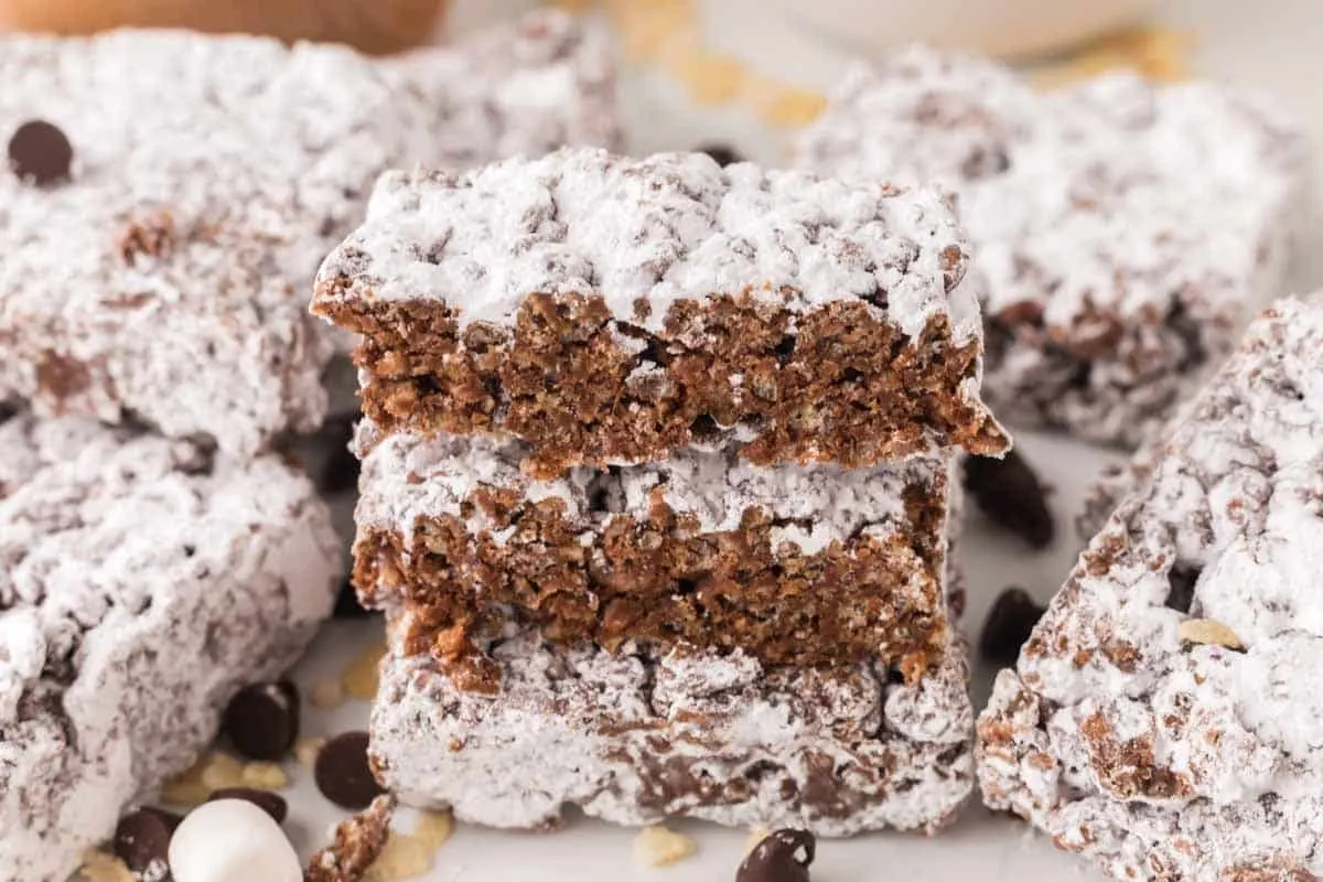 muddy buddy rice crispy treat bars stacked so you can see the middle.