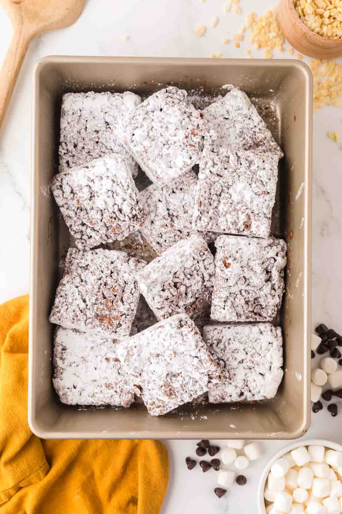 muddy buddy rice crispy treat bars in pan.